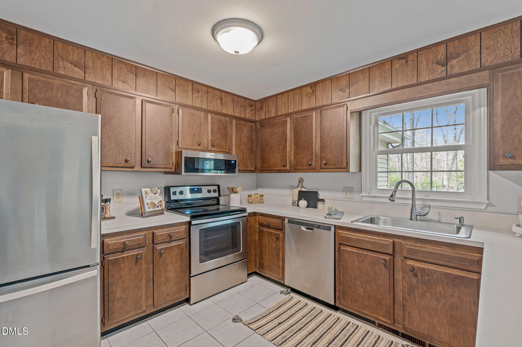 3304 Wade Avenue Raleigh, NC 27607 - Photo 15 of 38 a kitchen with a sink stove and cabinets