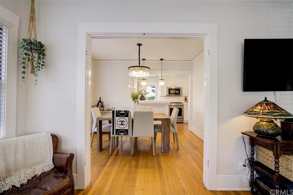 1030 Sinaloa Avenue Pasadena, CA 91104 - Photo 11 of 45 a dining room with furniture and wooden floor