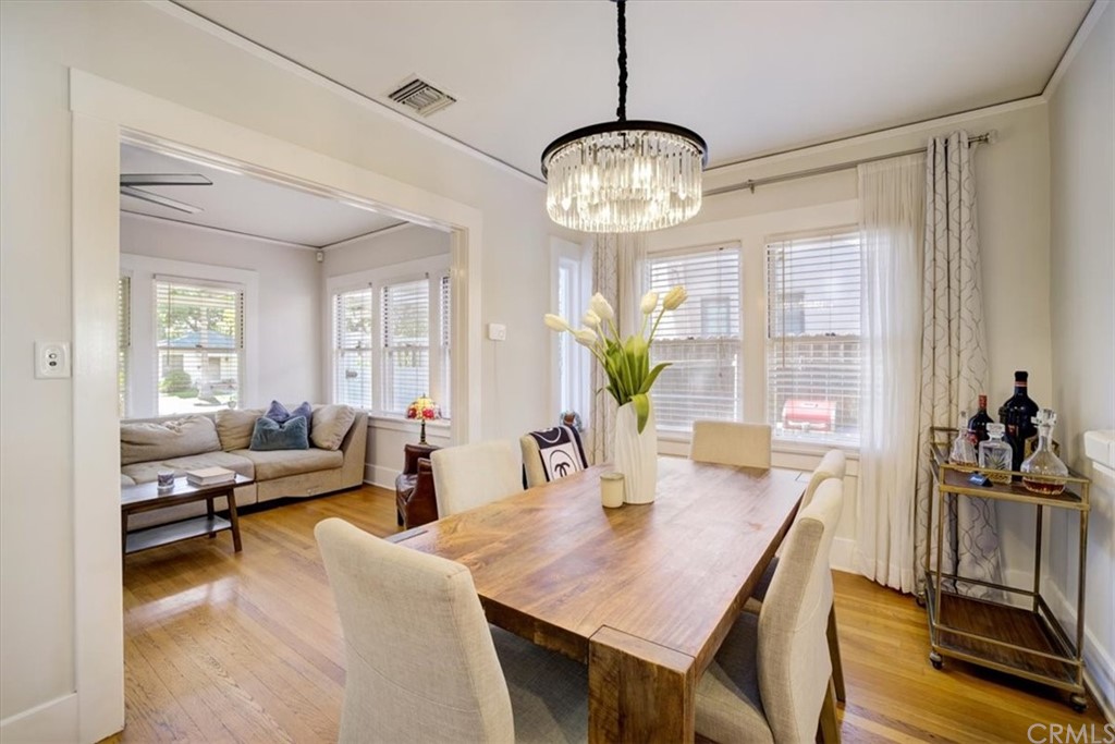 1030 Sinaloa Avenue Pasadena, CA 91104 - Photo 13 of 45 a view of a dining room with furniture window and wooden floor