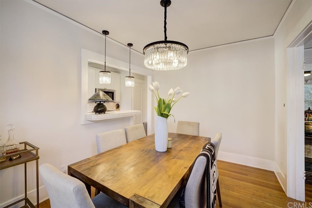 1030 Sinaloa Avenue Pasadena, CA 91104 - Photo 14 of 45 a view of a dining room with a table and chairs