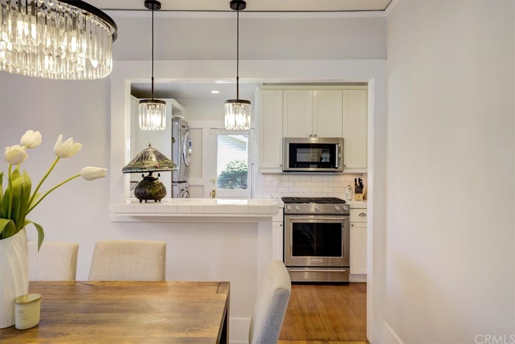 1030 Sinaloa Avenue Pasadena, CA 91104 - Photo 15 of 45 a kitchen with stainless steel appliances a stove a microwave and a potted plant