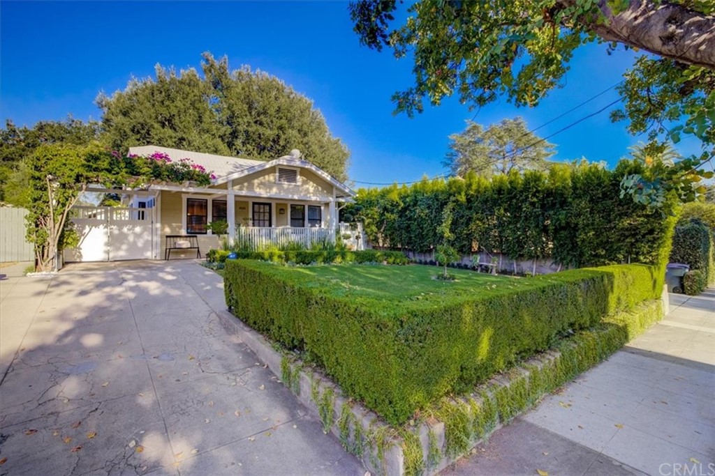 1030 Sinaloa Avenue Pasadena, CA 91104 - Photo 2 of 45 a front view of a house with a garden