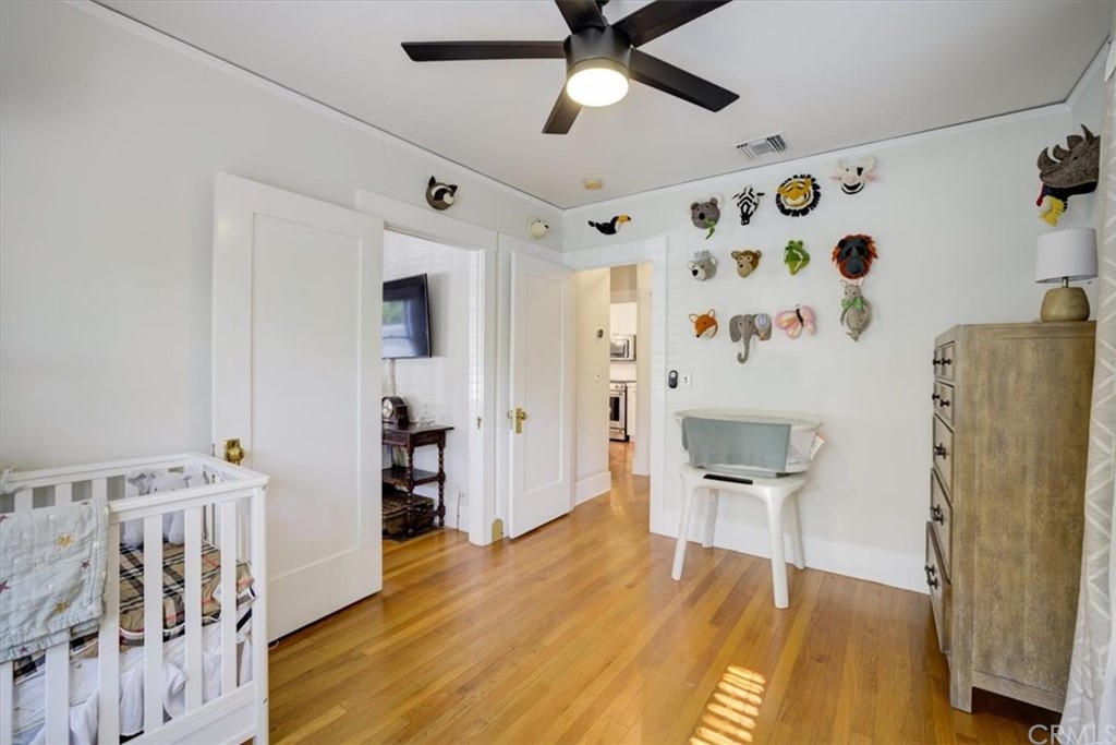 1030 Sinaloa Avenue Pasadena, CA 91104 - Photo 22 of 45 a bedroom with furniture and wooden floor