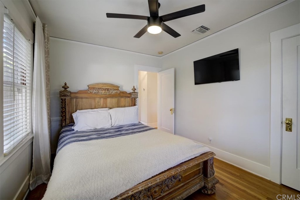 1030 Sinaloa Avenue Pasadena, CA 91104 - Photo 27 of 45 a bedroom with a bed and a flat screen tv