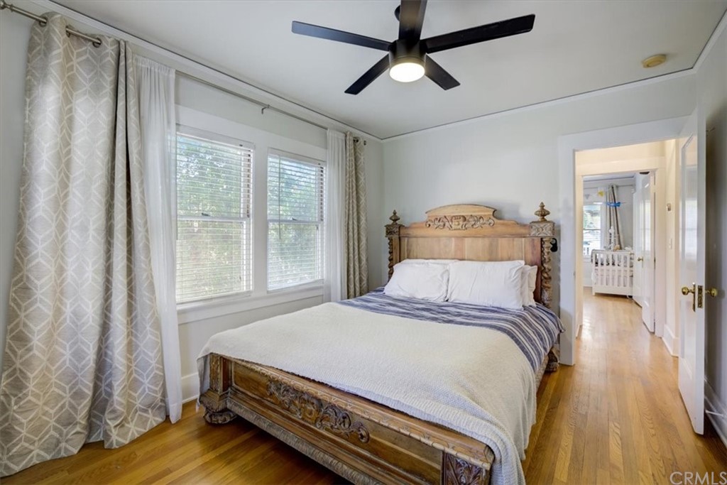 1030 Sinaloa Avenue Pasadena, CA 91104 - Photo 28 of 45 a bedroom with a bed and wooden floor