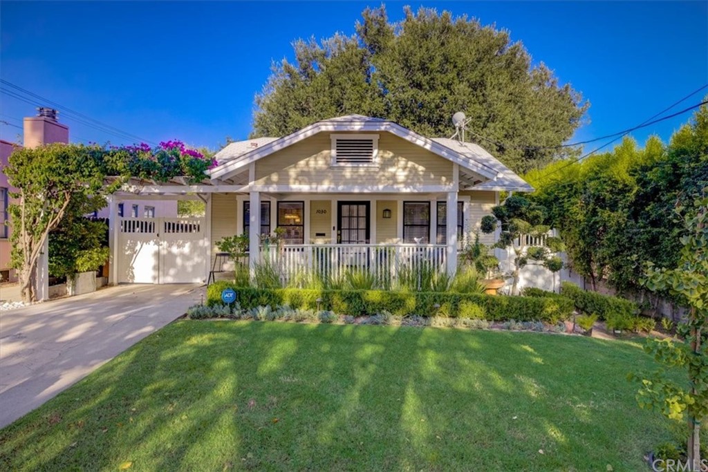 1030 Sinaloa Avenue Pasadena, CA 91104 - Photo 3 of 45 a front view of a house with a yard