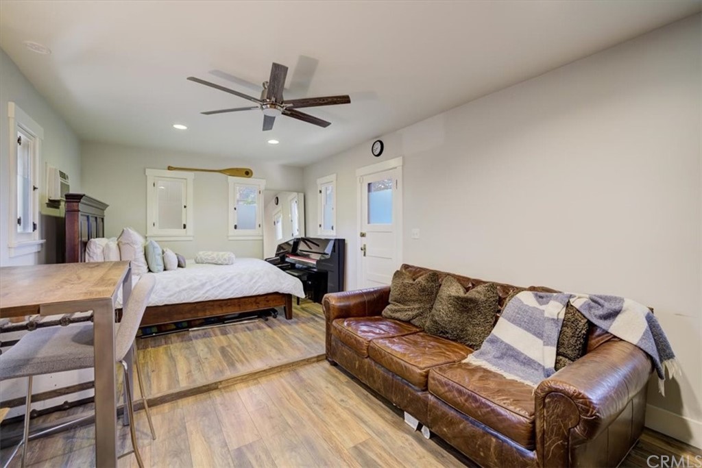 1030 Sinaloa Avenue Pasadena, CA 91104 - Photo 34 of 45 a living room with furniture and a wooden floor