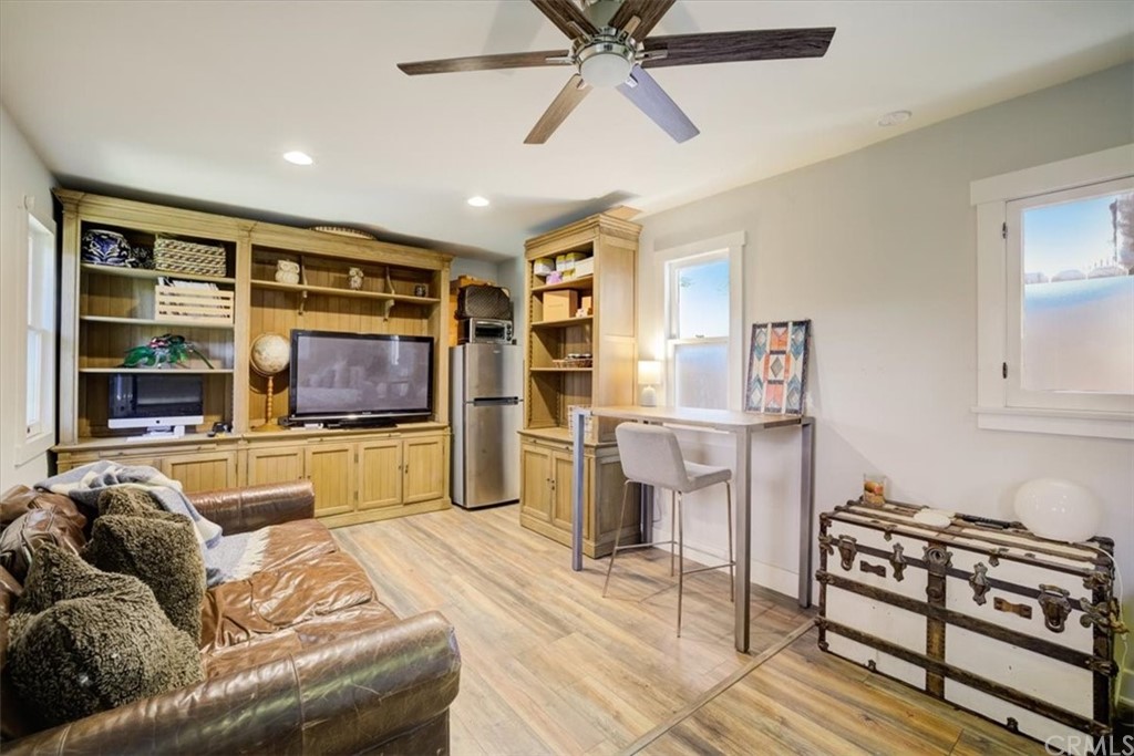 1030 Sinaloa Avenue Pasadena, CA 91104 - Photo 35 of 45 a living room with furniture and a flat screen tv