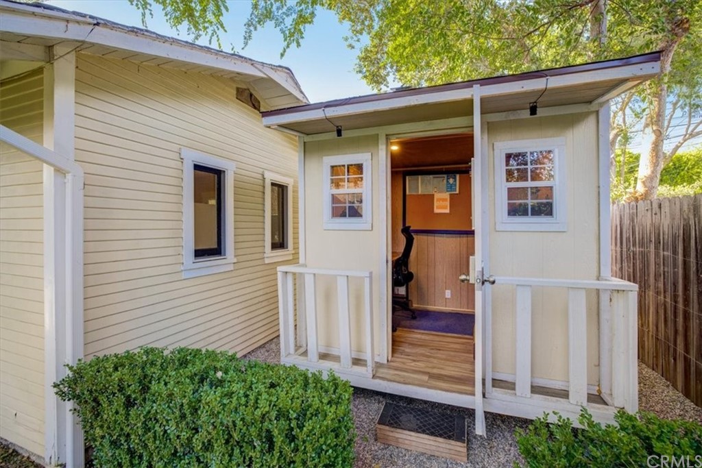 1030 Sinaloa Avenue Pasadena, CA 91104 - Photo 38 of 45 a view of a house with a small yard and wooden floor and fence