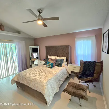 a bedroom with a bed and chair
