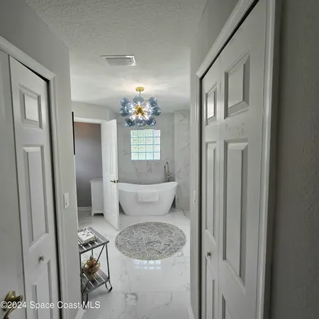 a bathroom with a sink vanity and mirror