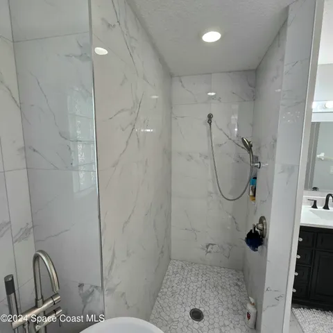 a dining room with furniture and a chandelier