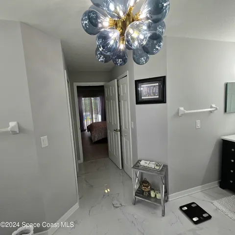 a spacious bathroom with a sink mirror and shower