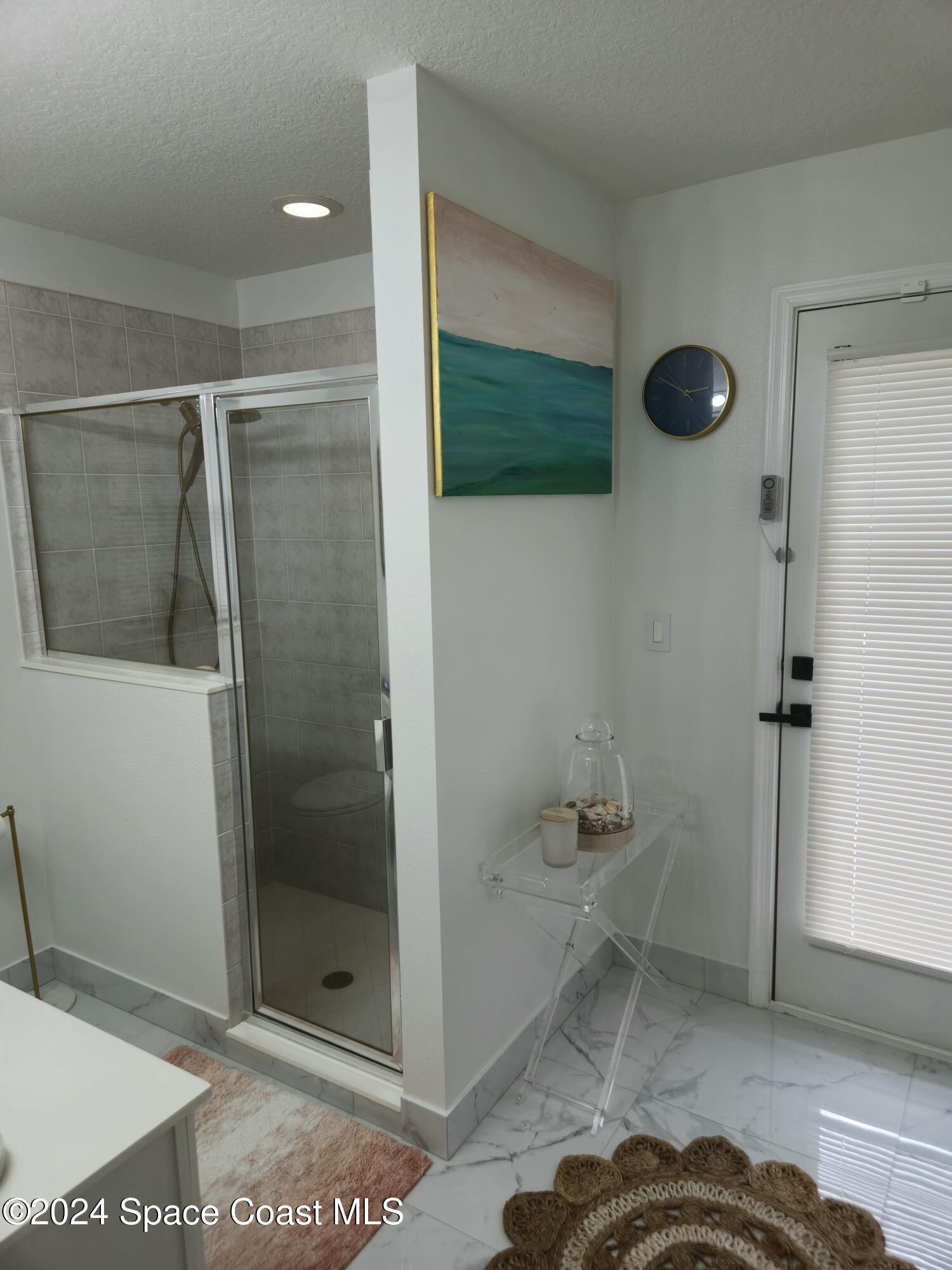 491 South Key Lime Square Southwest Vero Beach, FL 32968 - Photo 20 of 29 a bathroom with a shower and a sink