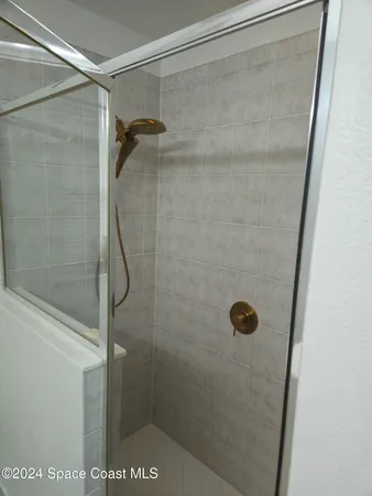 a bathroom with a sink toilet and mirror