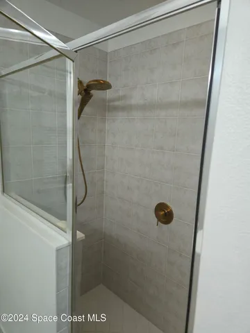 a bathroom with a sink toilet and mirror