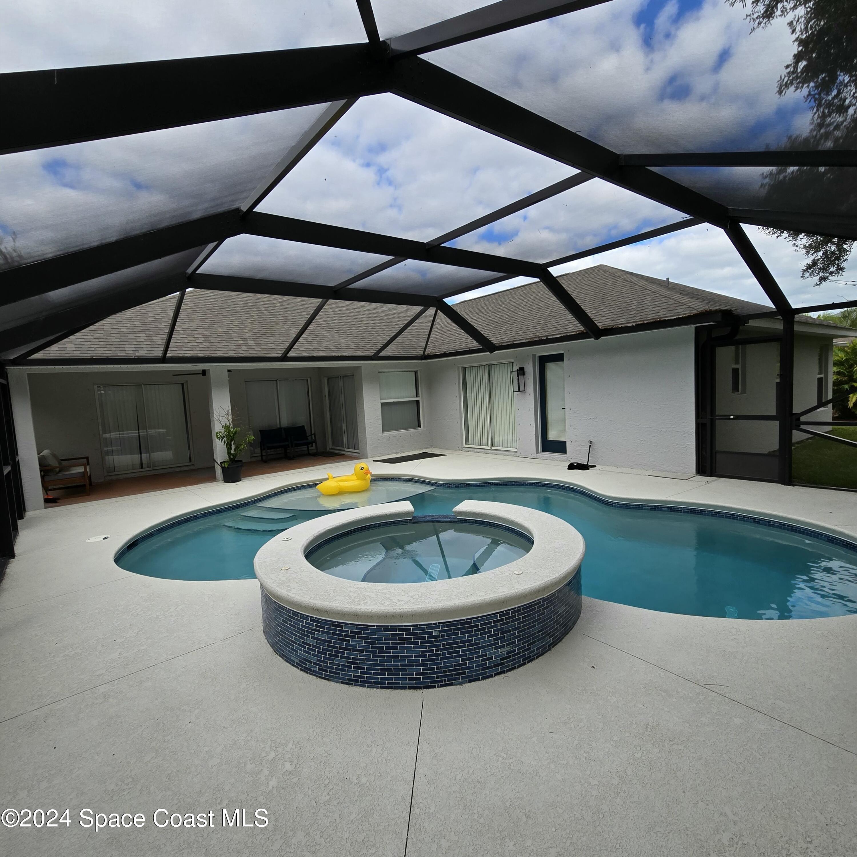 491 South Key Lime Square Southwest Vero Beach, FL 32968 - Photo 28 of 29 a view of a swimming pool with a yard