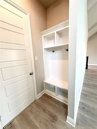 a kitchen with a sink a counter space and cabinets