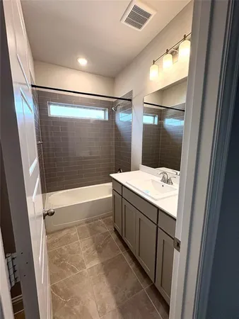 a view of an empty room and a window
