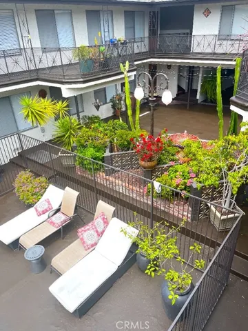 a view of a chairs and table in a patio