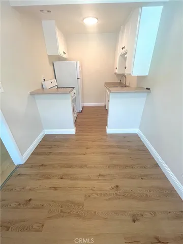 a view of a kitchen with a sink