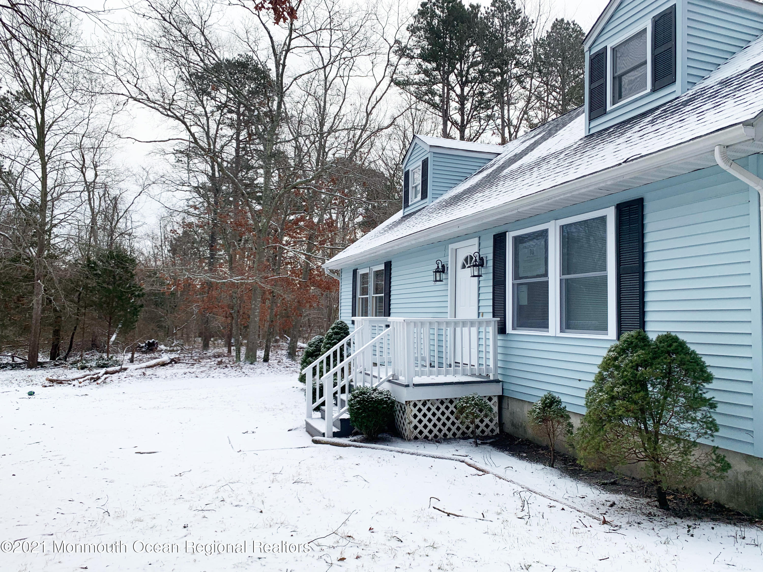 88 W Road Tuckerton, NJ 08087 - Photo 2 of 25 a view of a house with a yard covered in snow