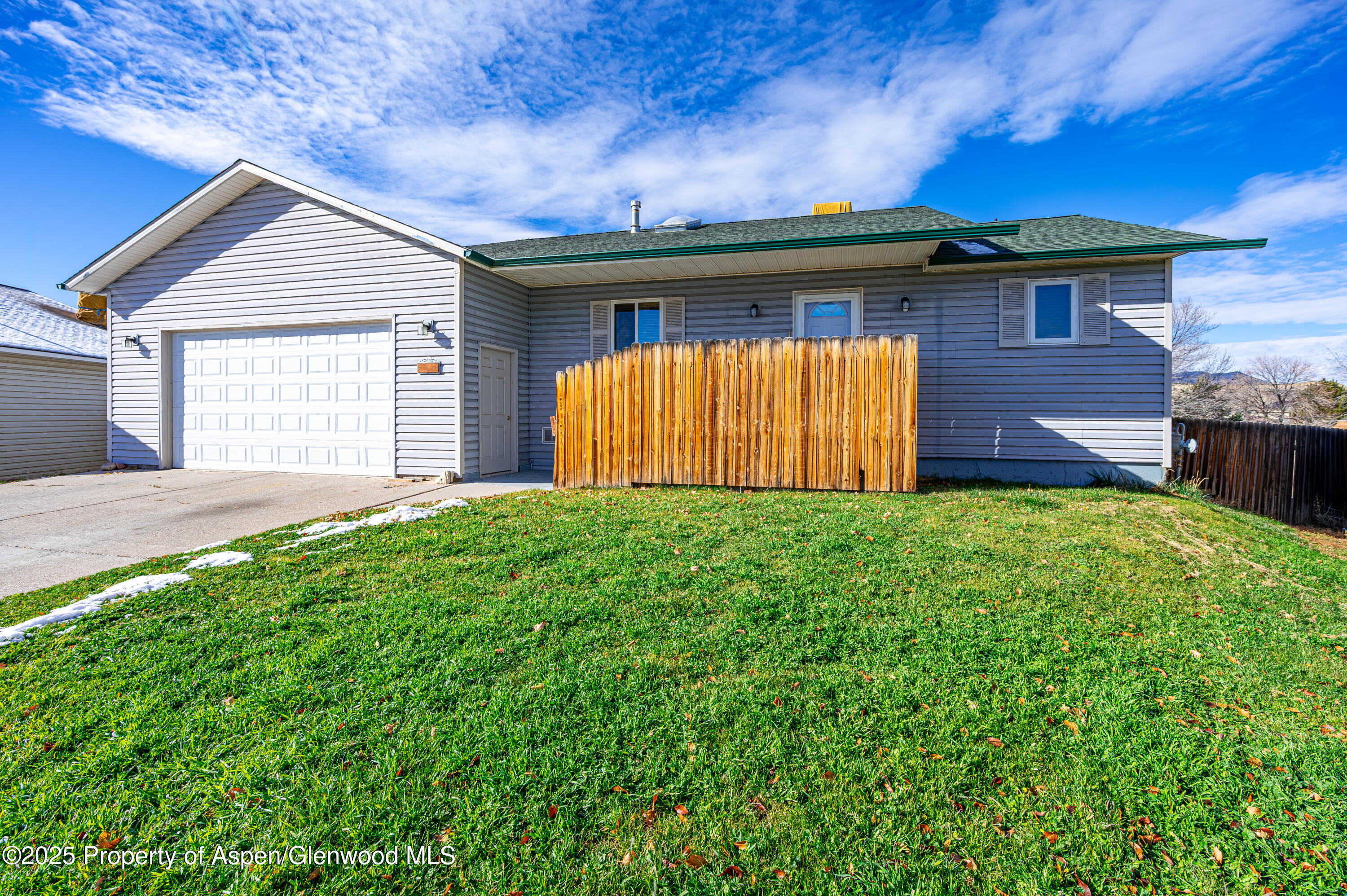 a view of house with backyard