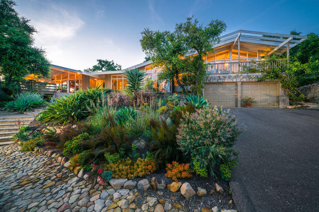 1815 Gibraltar Road Santa Barbara, CA 93105 - Photo 5 of 26 view of a house with a yard and a garden