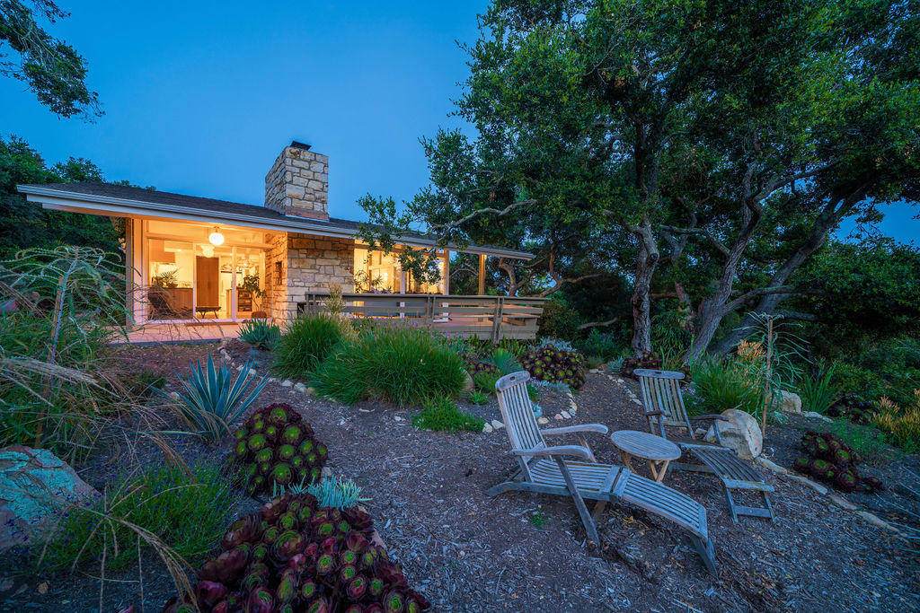 1815 Gibraltar Road Santa Barbara, CA 93105 - Photo 8 of 26 a view of a patio with table and chairs potted plants and large tree