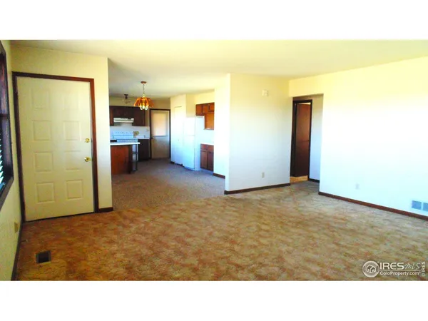 a view of a room with a barbeque and dryer