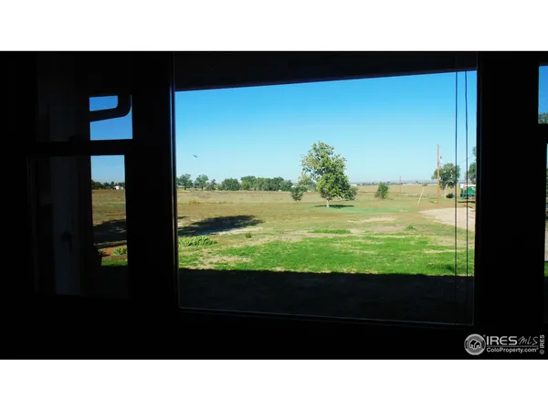 a kitchen with stainless steel appliances kitchen island granite countertop a sink refrigerator and cabinets