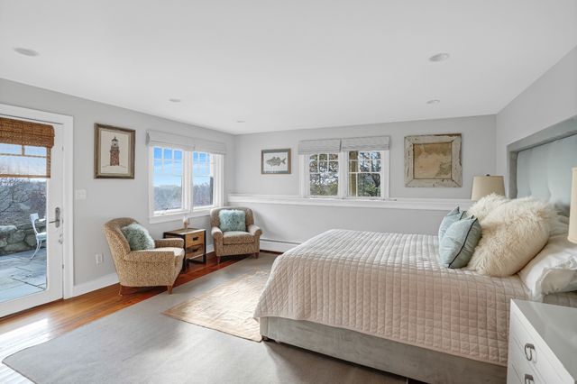 a bedroom with a bed and couch