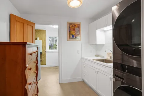 a view of a kitchen with storage and utility