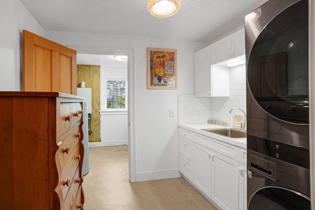 a view of a kitchen with storage and utility