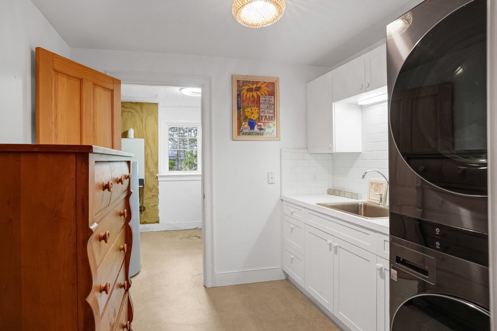 4 Nomans Watch Road Aquinnah, MA 02535 - Photo 25 of 36 a view of a kitchen with storage and utility