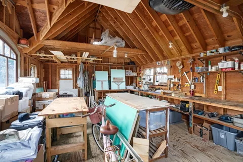 a dining room with lots of wooden furniture