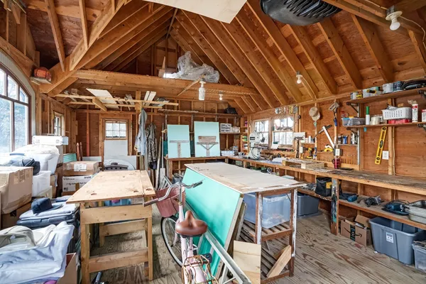 a dining room with lots of wooden furniture
