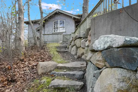 a view of a house with a yard
