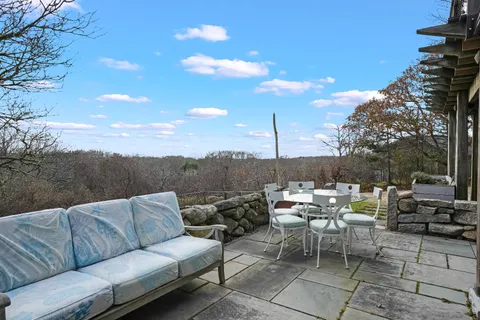 a view of a terrace with furniture