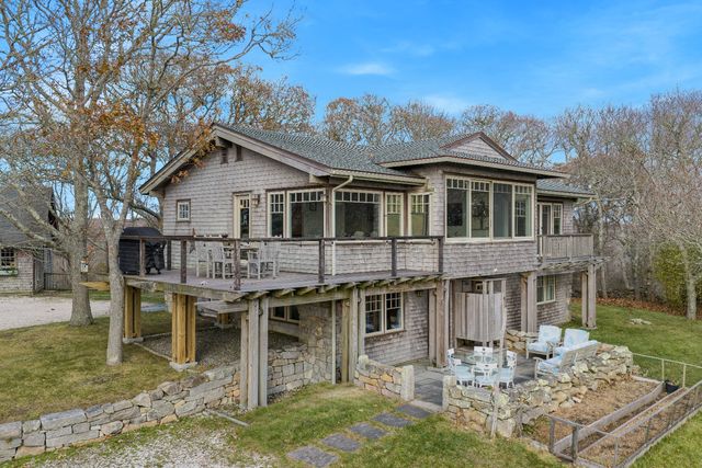 a view of a house with yard porch and sitting area