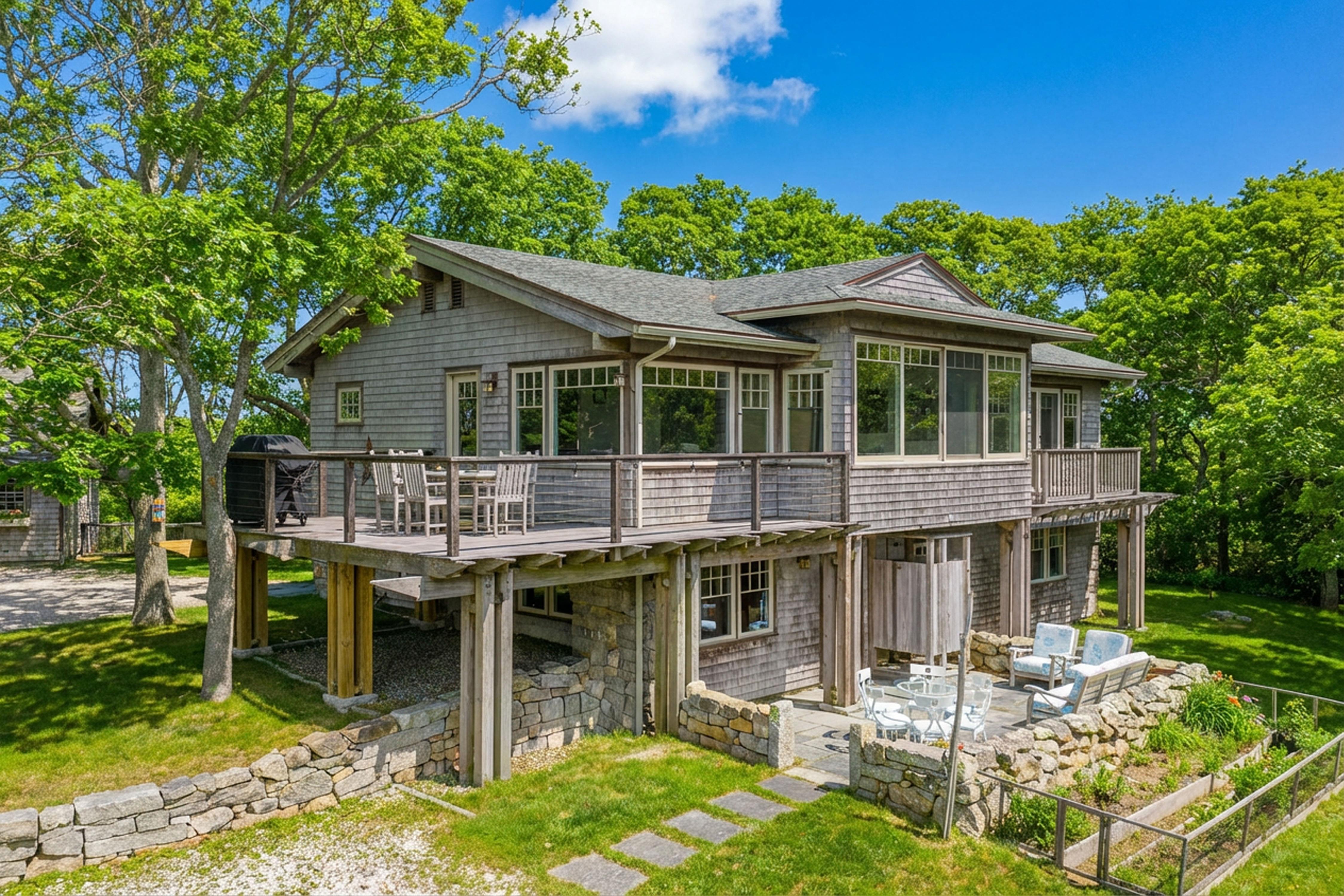 4 Nomans Watch Road Aquinnah, MA 02535 - Photo 3 of 36 a view of a house with a yard patio and furniture