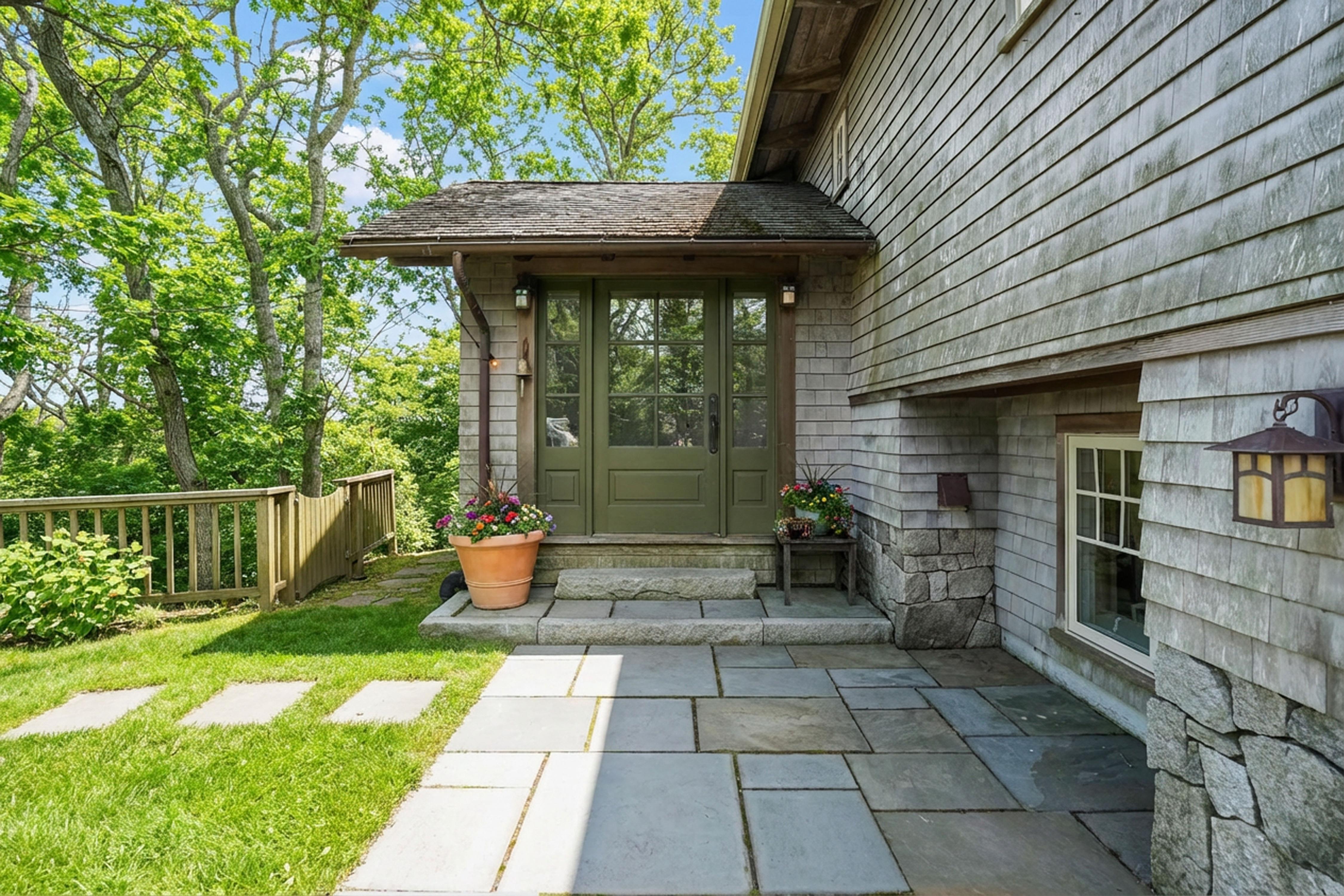 4 Nomans Watch Road Aquinnah, MA 02535 - Photo 4 of 36 a view of a patio with a chairs and table in a patio