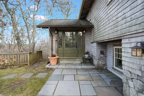 a backyard of a house with seating space