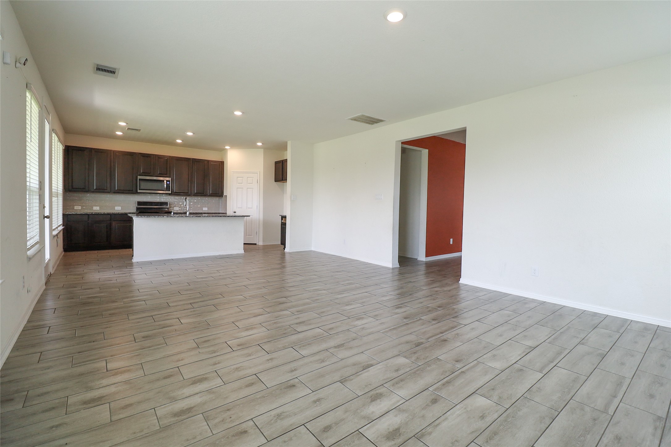 1418 Red Hills Drive Rosharon, TX 77583 - Photo 12 of 36 a view of kitchen with stainless steel appliances granite countertop a stove top oven a sink and a microwave