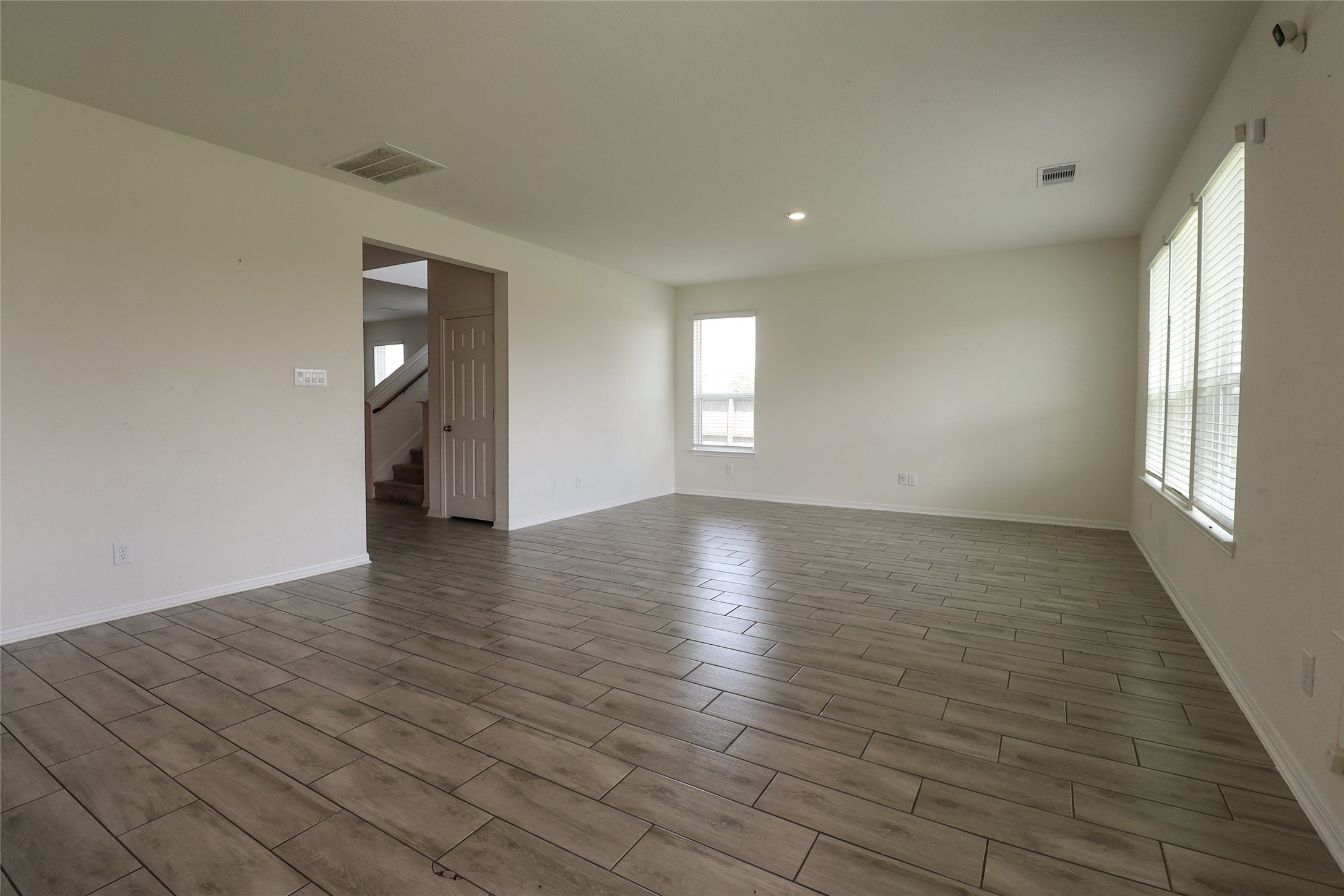 1418 Red Hills Drive Rosharon, TX 77583 - Photo 13 of 36 wooden floor in an empty room with a window