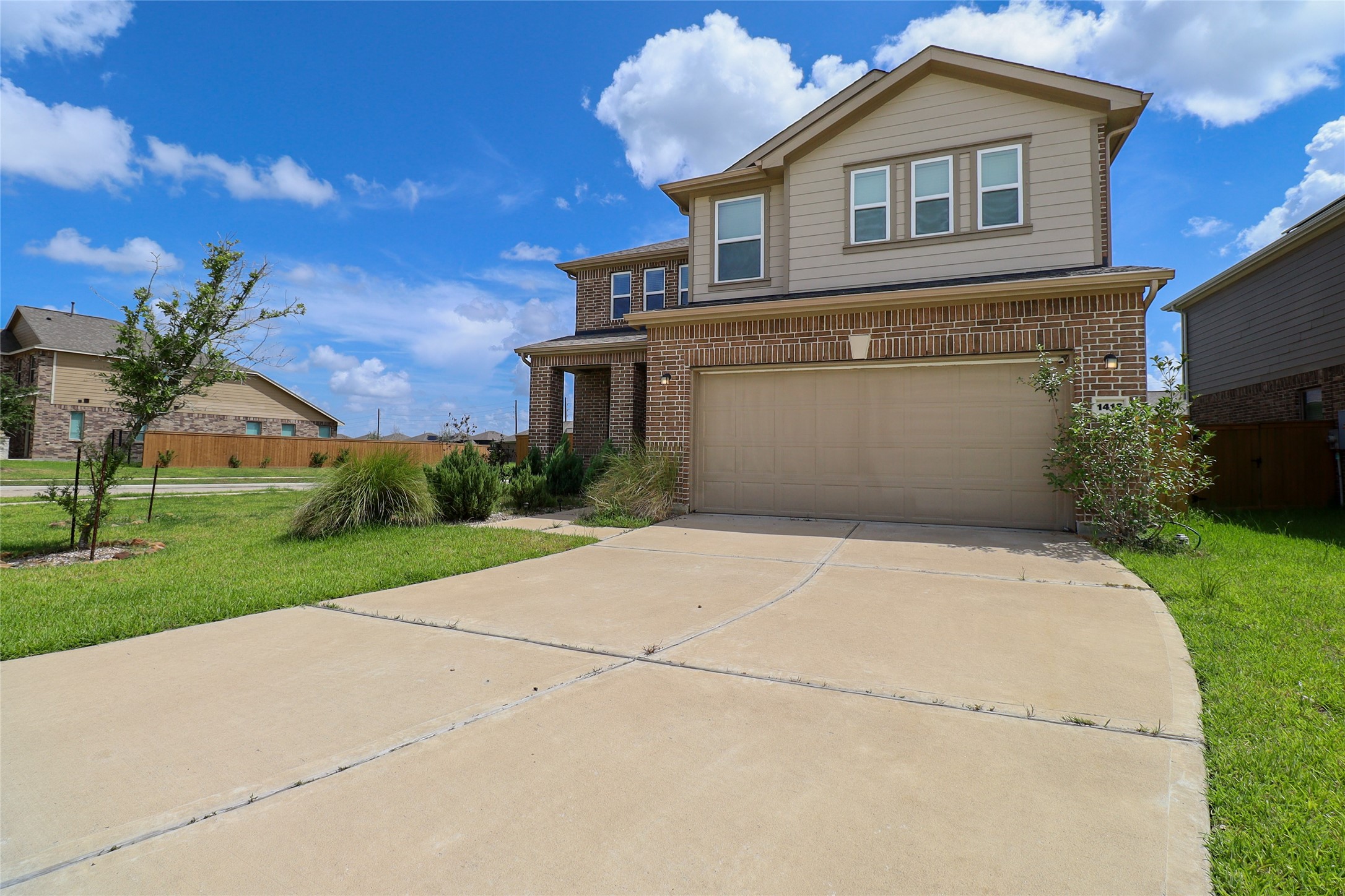 1418 Red Hills Drive Rosharon, TX 77583 - Photo 2 of 36 a front view of a house with a yard and garage