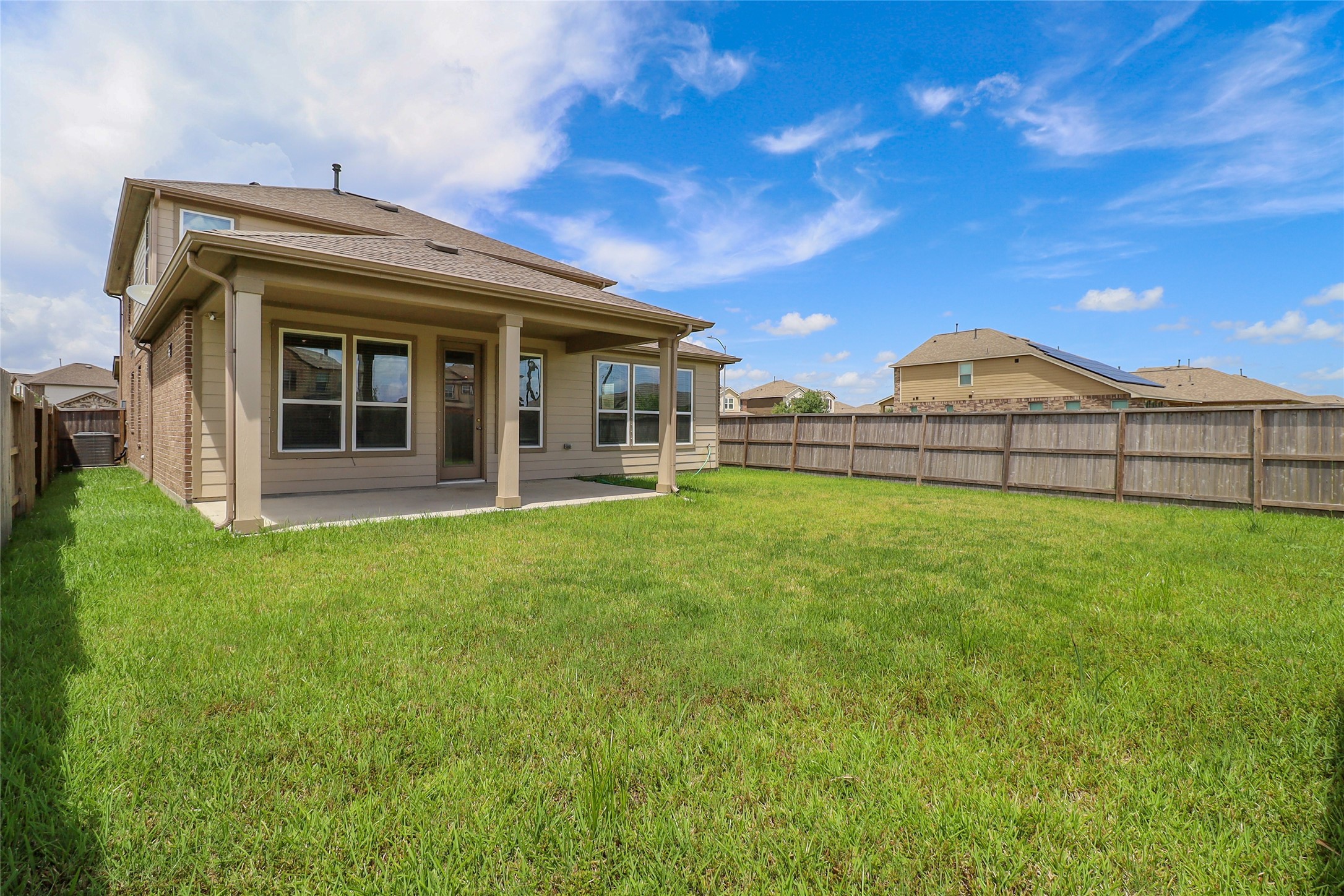 1418 Red Hills Drive Rosharon, TX 77583 - Photo 26 of 36 a view of a house with a large window and a yard