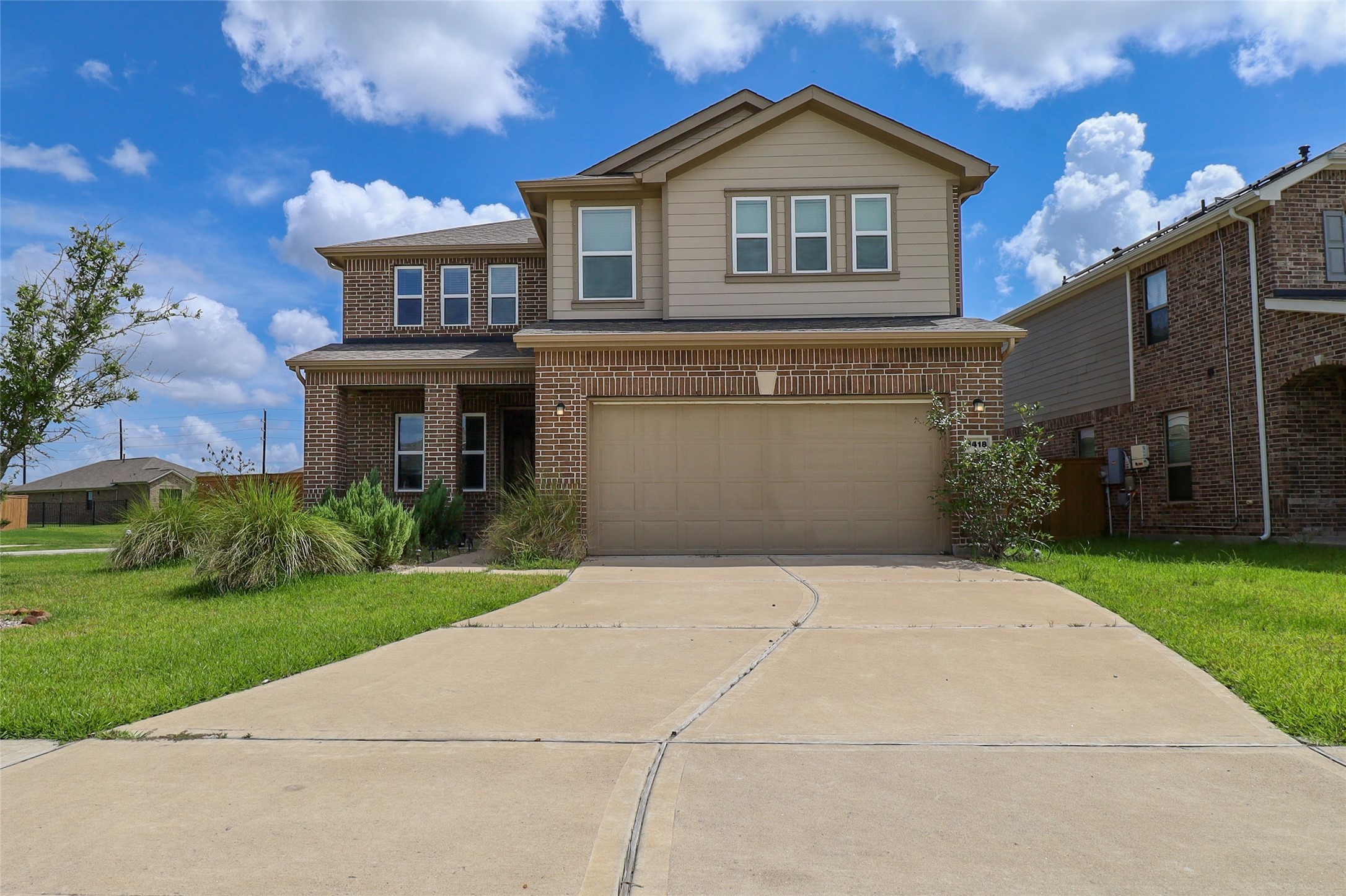 1418 Red Hills Drive Rosharon, TX 77583 - Photo 3 of 36 a front view of a house with a yard and garage