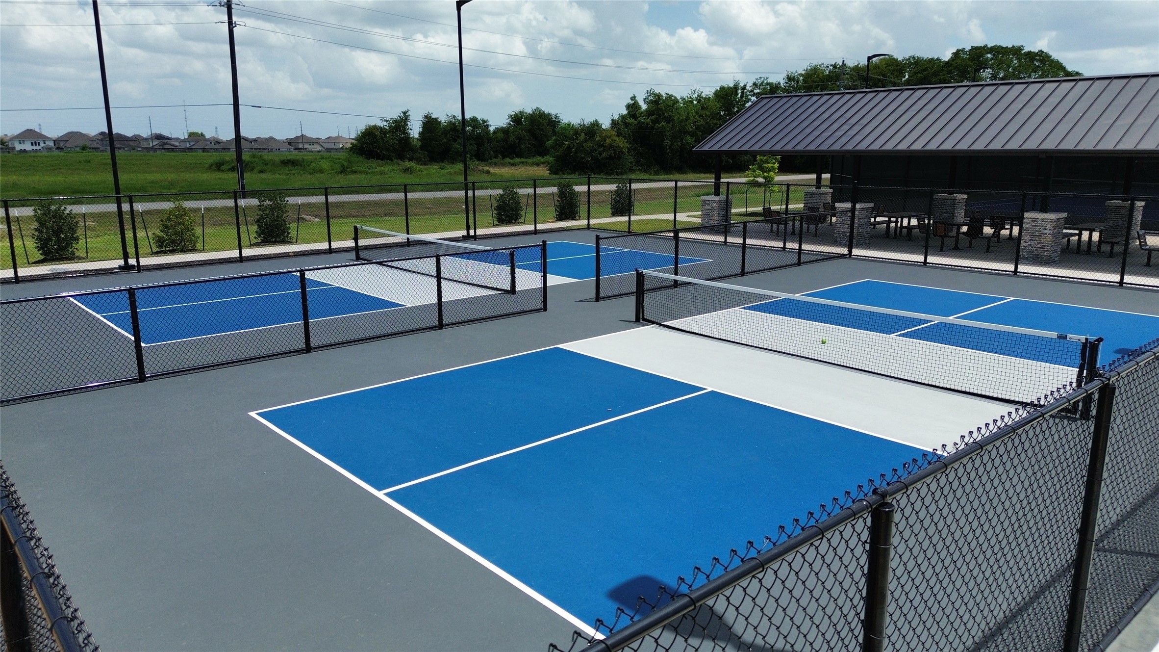 1418 Red Hills Drive Rosharon, TX 77583 - Photo 35 of 36 a roof deck with a table and chairs
