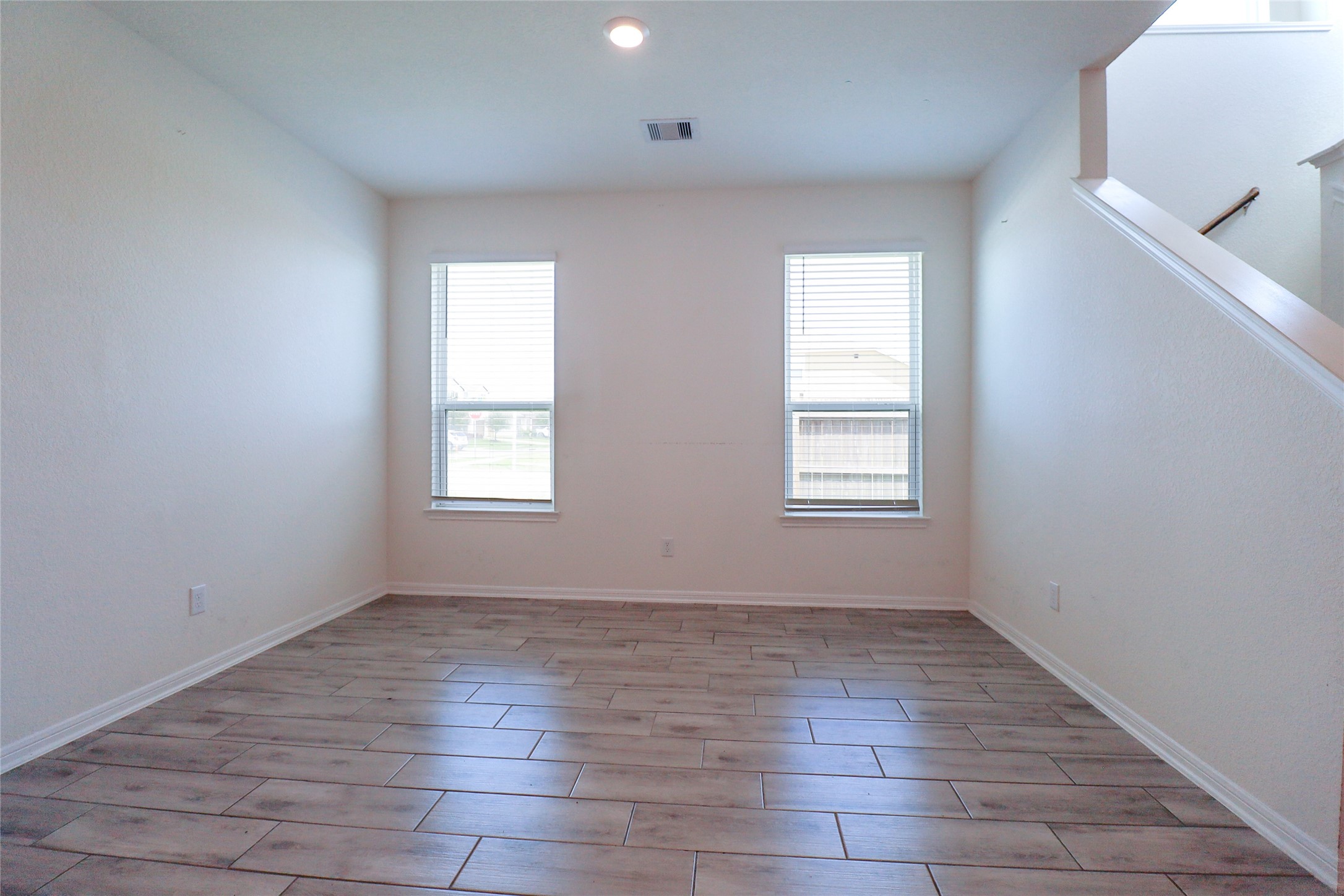 1418 Red Hills Drive Rosharon, TX 77583 - Photo 6 of 36 wooden floor in an empty room with a window